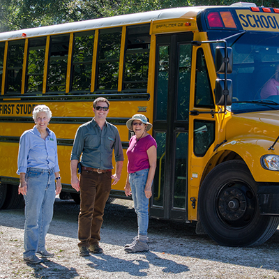 Visitors in front of bus